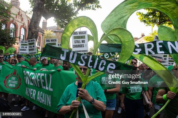 Thousands of local people and survivors join the sixth anniversary Silent Walk on June 14, 2023 in London, England. A fire broke out in Grenfell...