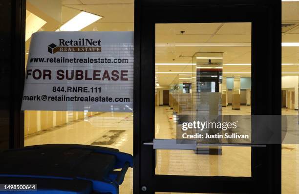 Sign is posted on the window of a retail space for lease on June 14, 2023 in San Francisco, California. San Francisco's downtown continues to...
