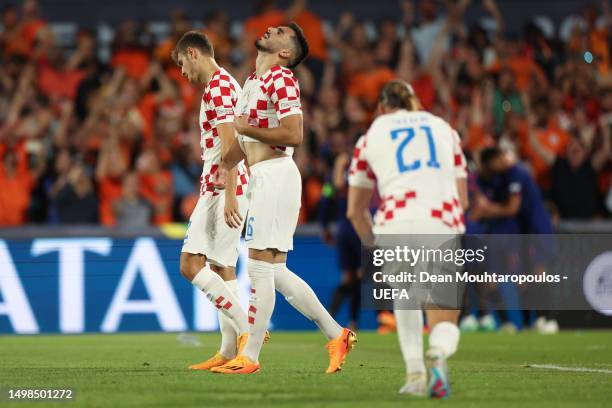 Josip Sutalo of Croatia reacts after Noa Lang of Netherlands scores the team's second goal during the UEFA Nations League 2022/23 semifinal match...