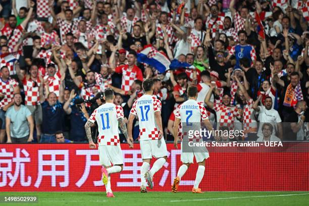 Bruno Petkovic of Croatia celebrates with teammates after scoring the team's third goal during the UEFA Nations League 2022/23 semifinal match...