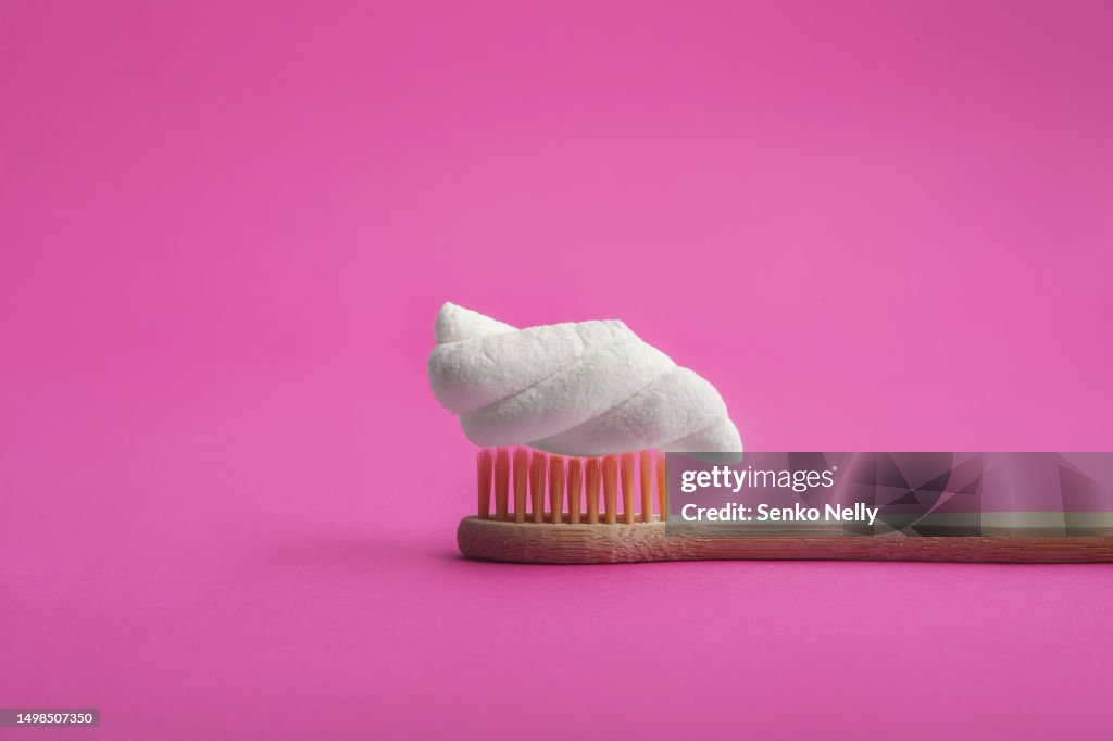 Marshmallow on wooden toothbrush close up.