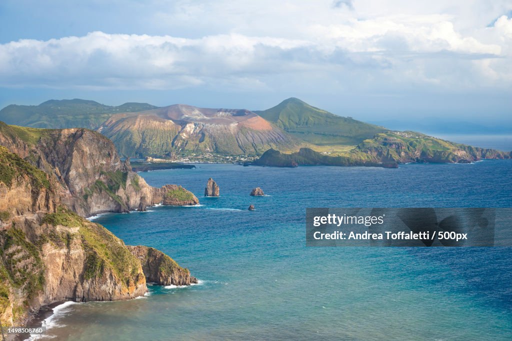 Scenic view of sea and mountains against sky,Lipari,Messina,Italy