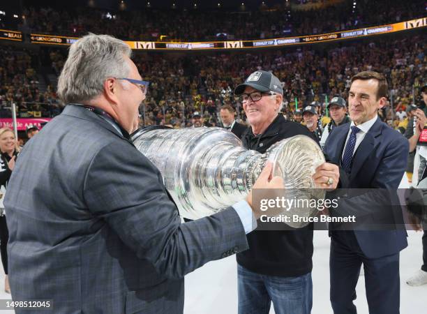 General Manager Kelly McCrimmon, Owner Bill Foley and George McPhee of the Vegas Golden Knights celebrate the Stanley Cup victory over the Florida...