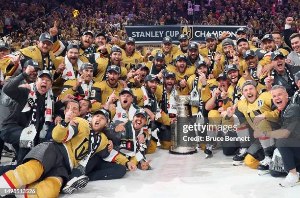 Members of the Vegas Golden Knights pose with the Stanley Cup after defeating the Florida Panthers to win the championship in Game Five of the 2023...