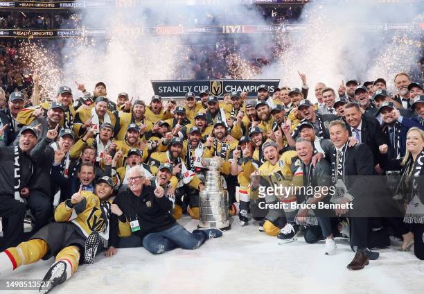 Members of the Vegas Golden Knights pose with the Stanley Cup after defeating the Florida Panthers to win the championship in Game Five of the 2023...