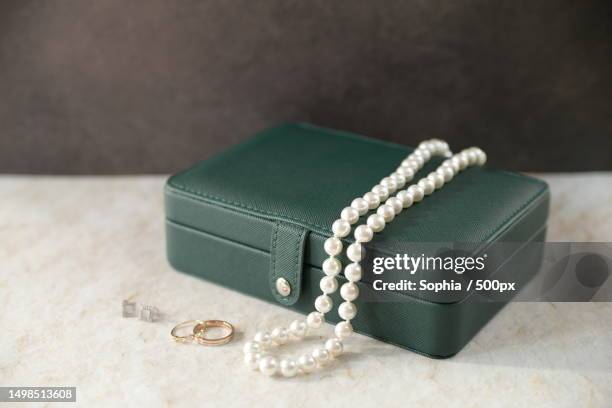 close-up of jewelry box on table - schmuckschatulle stock-fotos und bilder