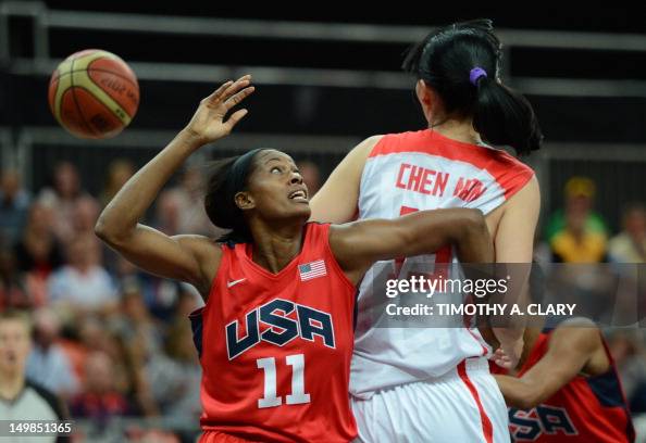 Chinese forward Ma Zengyu vies with US forward Swin Cash during the