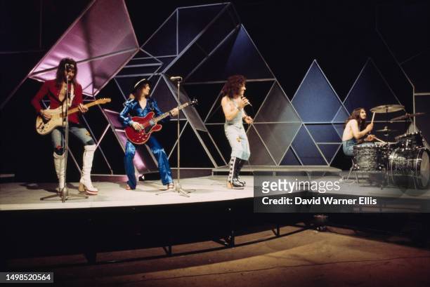 British rock band Geordie performing on the BBC music programme, 'Top Of The Pops', London, 1973. Left to right: Vic Malcolm, Tom Hill, Brian Johnson...