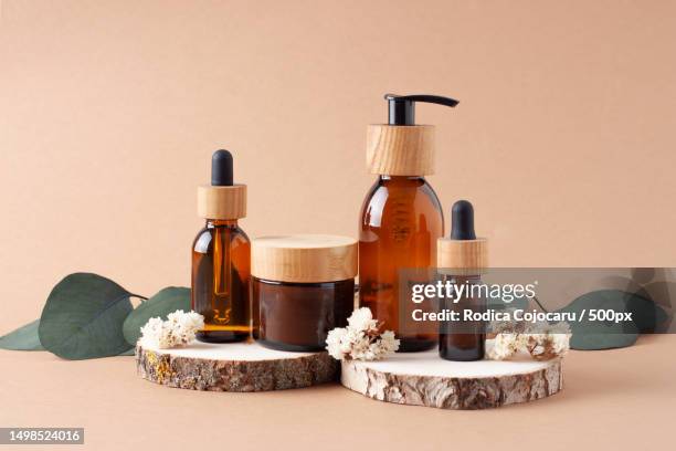 close-up of bottles against brown background - hair products ストックフォトと画像