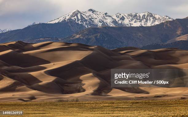 scenic view of snowcapped mountains against sky,great sand dunes national park,colorado,united states,usa - great sand dunes national park 個照片及圖片檔