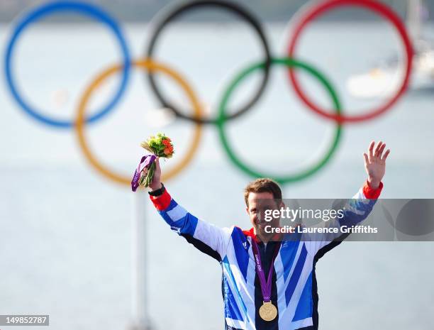 Ben Ainslie of Great Britain celebrates winning gold in the Finn Class Medal race at Weymouth Harbour on August 5, 2012 in Weymouth, England.