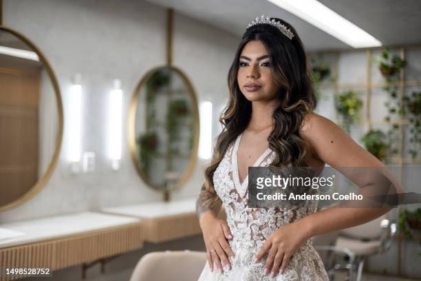 latin woman dressed as a bride getting dressed in beauty salon - brazilian female models 個照片及圖片檔
