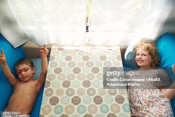 children on vacation in their caravan. summer vacation - entourage stock pictures, royalty-free photos & images