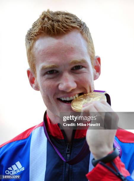 Gold medalist Greg Rutherford of Great Britain pose on the podium for Men's Long Jump on Day 9 of the London 2012 Olympic Games at the Olympic...