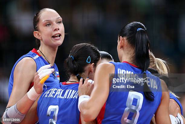 Ekaterina Gamova of Russia celebrates a set win with her teammates in the fourth set against Italy during Women's Volleyball on Day 9 of the London...