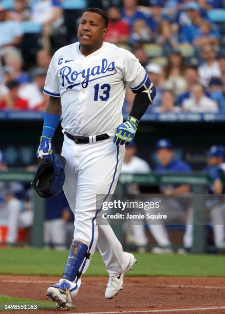 Salvador Perez of the Kansas City Royals reacts after being hit by a pitch during the 3rd inning of the game against the Cincinnati Reds at Kauffman...