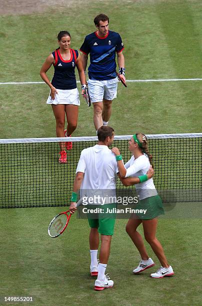 Laura Robson of Great Britain and Andy Murray of Great Britain react as Victoria Azarenka of Belarus and Max Mirnyi of Belarus celebrate winning the...