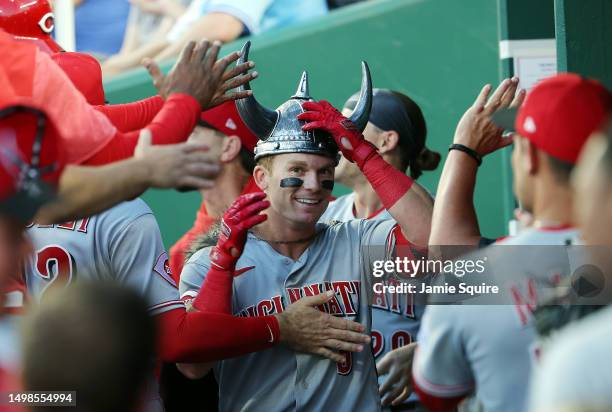 Matt McLain of the Cincinnati Reds is congratulated by teammates in the dugout after hitting a home run during the 5th inning of the game against the...