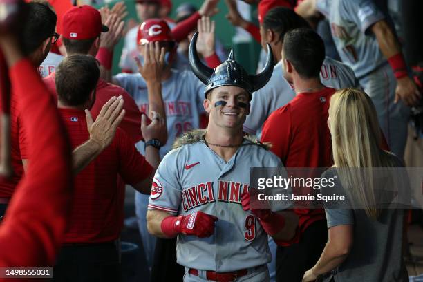 Matt McLain of the Cincinnati Reds is congratulated by teammates in the dugout after hitting a home run during the 5th inning of the game against the...