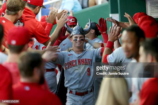 Matt McLain of the Cincinnati Reds is congratulated by teammates in the dugout after hitting a home run during the 5th inning of the game against the...