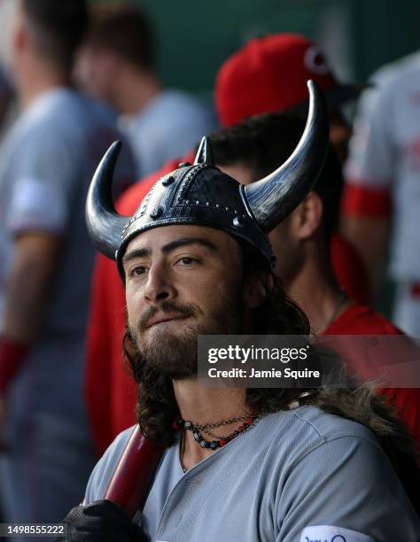 Jonathan India of the Cincinnati Reds is congratulated by teammates in the dugout after hitting a home run during the 5th inning of the game against...