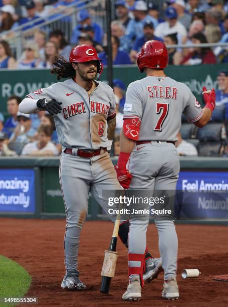 Jonathan India of the Cincinnati Reds is congratulated by Spencer Steer after hitting a home run during the 5th inning of the game against the Kansas...