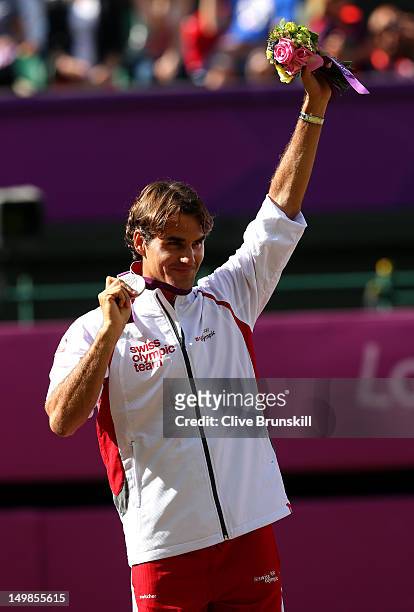 Silver medalist Roger Federer of Switzerland poses during the medal ceremony for the Men's Singles Tennis match on Day 9 of the London 2012 Olympic...