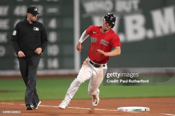 Rob Refsnyder of the Boston Red Sox rounds third to score during the first inning against the Colorado Rockies at Fenway Park on June 14, 2023 in...
