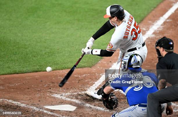 Adley Rutschman of the Baltimore Orioles hits a single in the seventh inning against the Toronto Blue Jays at Oriole Park at Camden Yards on June 14,...