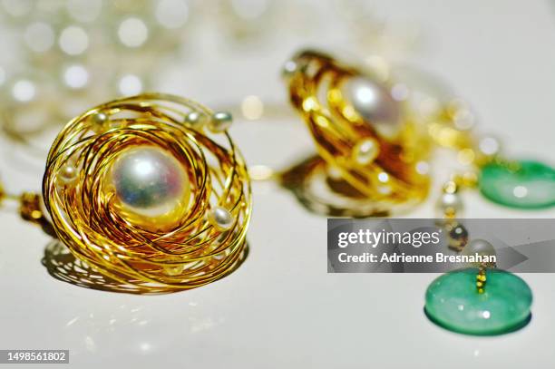 close-up of pearl and gold earrings - jade close stock pictures, royalty-free photos & images