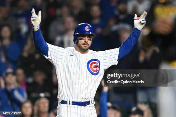 Mike Tauchman of the Chicago Cubs celebrates his two-run single in the sixth inning against the Pittsburgh Pirates at Wrigley Field on June 14, 2023...