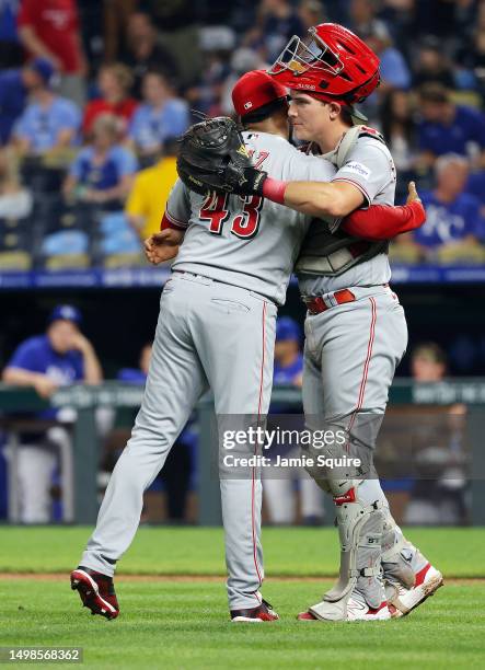 Pitcher Alexis Diaz and catcher Tyler Stephenson of the Cincinnati Reds congratulate each other after the Reds defeated the Kansas City Royals 7-4 to...