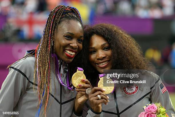 Gold medalists Serena Williams of the United States and Venus Williams of the United States celebrate during the medal ceremony for the Women's...