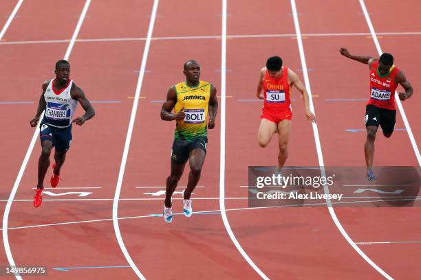 Dwain Chambers of Great Britain, Usain Bolt of Jamaica and Bingtian Su of China and Antoine Adams of Saint Kitts and Nevis compete in the Men's 100m...