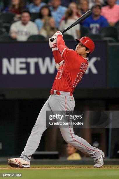 Shohei Ohtani of the Los Angeles Angels hits a two-run home run during the ninth inning against the Texas Rangers at Globe Life Field on June 14,...