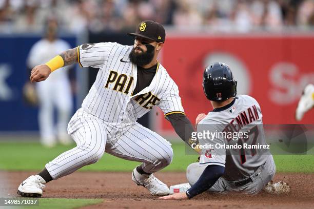 Will Brennan of the Cleveland Guardians is tagged out by Rougned Odor of the San Diego Padres attempting to steal second base during the second...