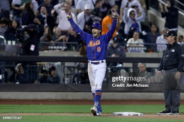 Brandon Nimmo of the New York Mets celebrates his tenth inning game winning RBI double against the the New York Yankees at Citi Field on June 14,...