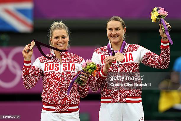 Bronze medalists Maria Kirilenko of Russia and Nadia Petrova of Russia pose with their medals during the medal ceremony for the Women's Doubles...