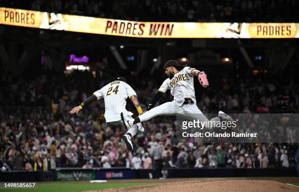 Fernando Tatis Jr. #23 of the San Diego Padres and Rougned Odor celebrate after defeating the Cleveland Guardians 5-0 at PETCO Park on June 14, 2023...