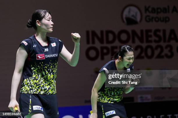 Mayu Matsumoto and Wakana Nagahara of Japan react in the Women's Doubles Second Round match against Benyapa Aimsaard and Nuntakarn Aimsaard of...