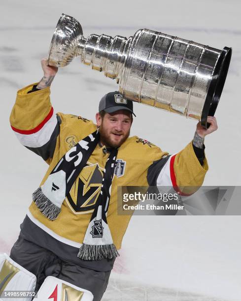 Jonathan Quick of the Vegas Golden Knights hoists the Stanley Cup after the team's 9-3 victory over the Florida Panthers in Game Five of the 2023 NHL...