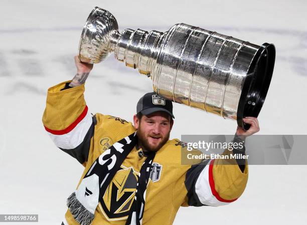 Jonathan Quick of the Vegas Golden Knights hoists the Stanley Cup after the team's 9-3 victory over the Florida Panthers in Game Five of the 2023 NHL...