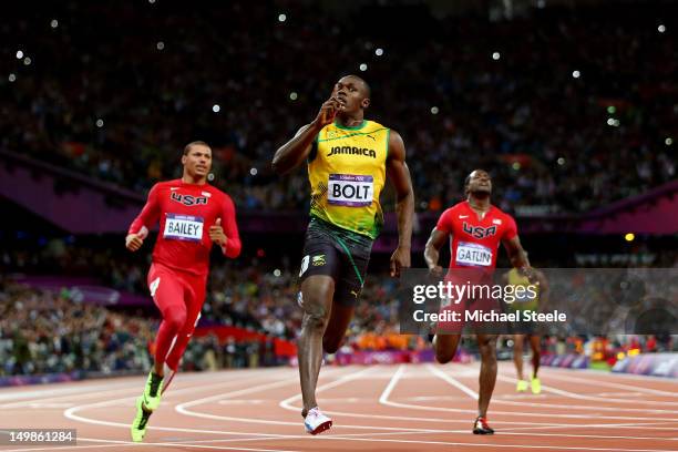 Usain Bolt of Jamaica celebrates winning gold in the Mens 100m Final on Day 9 of the London 2012 Olympic Games at the Olympic Stadium on August 5,...