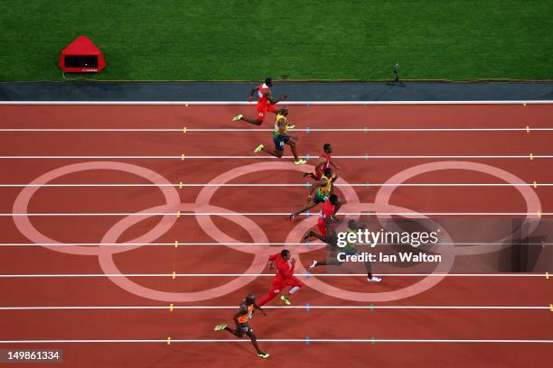 Usain Bolt of Jamaica on his way to winning gold in the Mens 100m Final on Day 9 of the London 2012 Olympic Games at the Olympic Stadium on August...