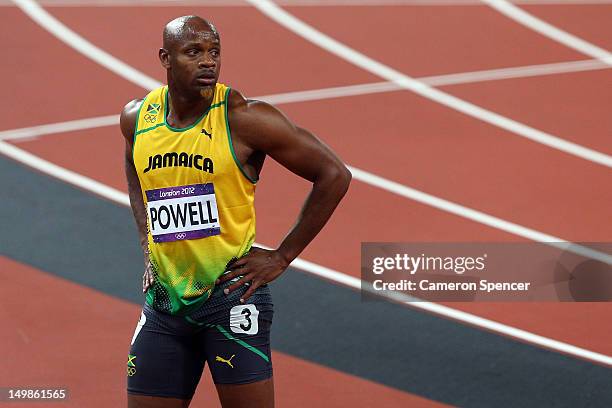 Asafa Powell of Jamaica looks on after the Men's 100m Final on Day 9 of the London 2012 Olympic Games at the Olympic Stadium on August 5, 2012 in...