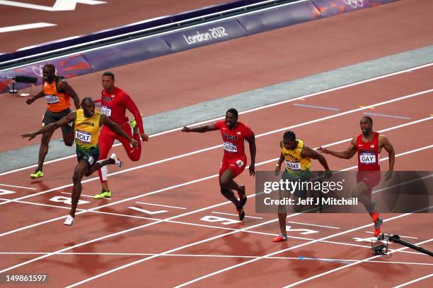 Usain Bolt of Jamaica runs ahead of Ryan Bailey of the United States, Yohan Blake of Jamaica and Justin Gatlin of the United States during the Men's...