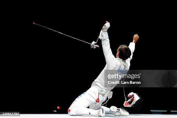 Andrea Baldini of Italy celebrates defeating Yuki Ota of Japan to win the gold medal match 45-39 in the Men's Foil Team Fencing finals on Day 9 of...