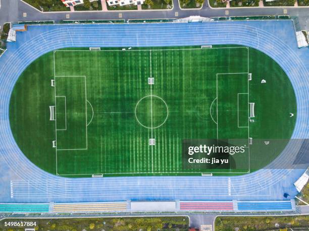 overlooking the school sports field, the blue running track and stadium. - soccer field outline stock pictures, royalty-free photos & images