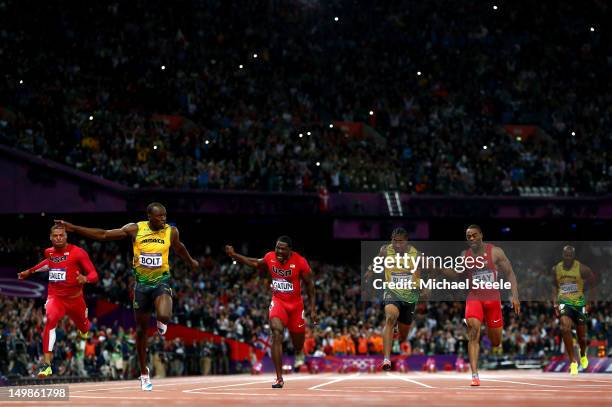 Usain Bolt of Jamaica crosses the finish line ahead of Ryan Bailey of the United States, Yohan Blake of Jamaica and Justin Gatlin of the United...