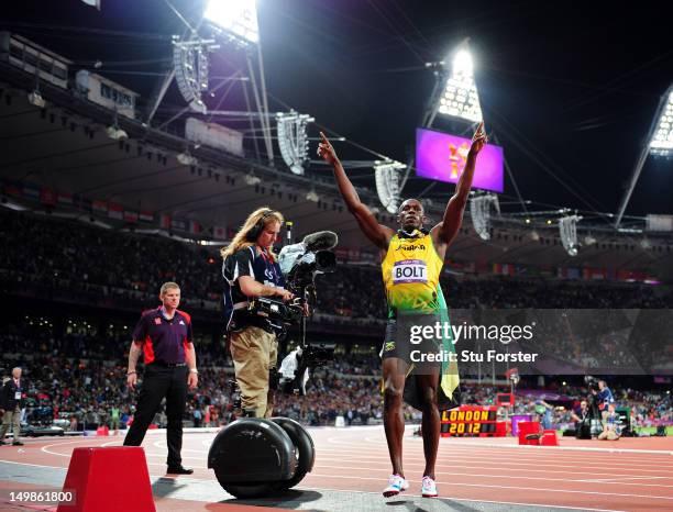 Usain Bolt of Jamaica celebrates winning gold in the Mens 100m Final on Day 9 of the London 2012 Olympic Games at the Olympic Stadium on August 5,...